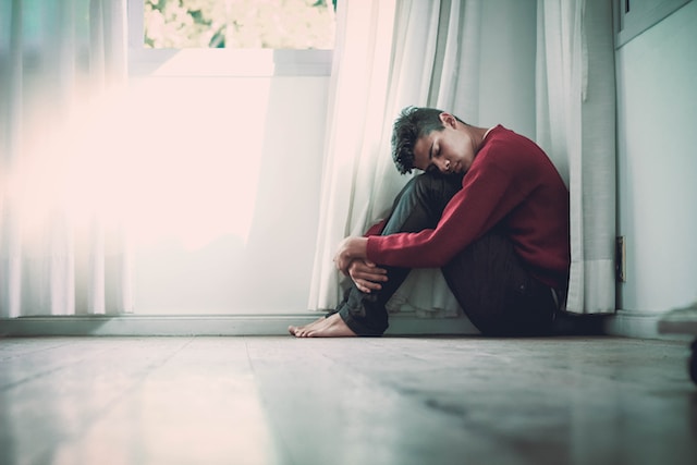 man sitting on the floor