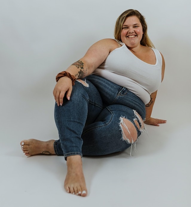 smiling woman sitting on the floor