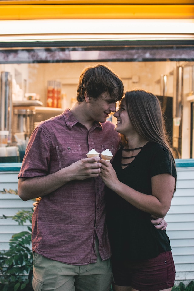 two couples smiling at each other