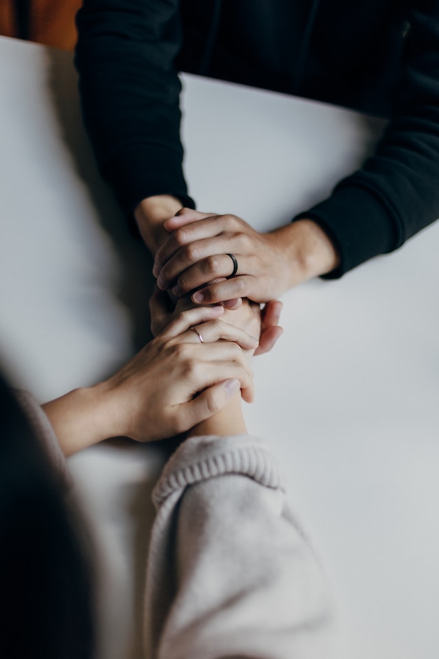 two people holding hands