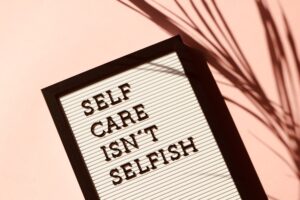 sign saying: self care isn't selfish
