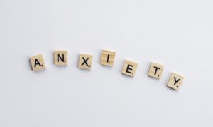 Anxiety spelled out with scrabble tiles