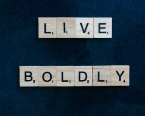 "Live Boldly" spelled in scrabble letters.