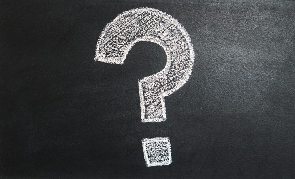 A question mark drawn on a chalkboard