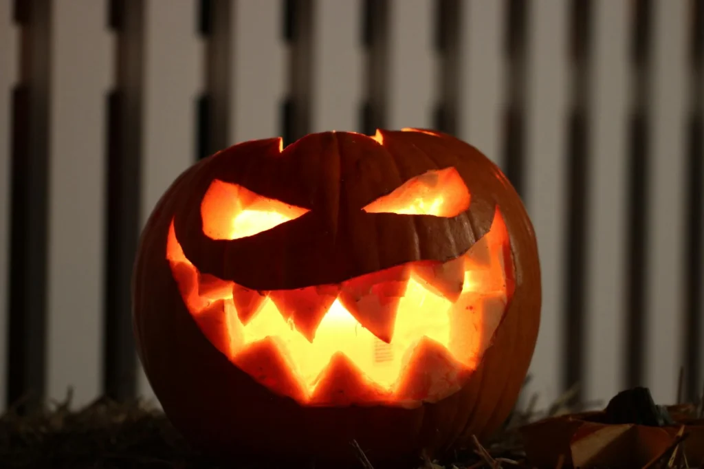 A lit up jack-o-lantern with a sharp-toothed maniacle smile.