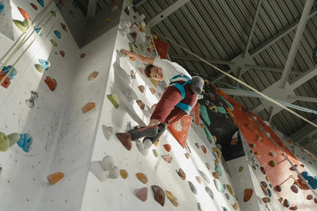 A person on a rock climbing wall.